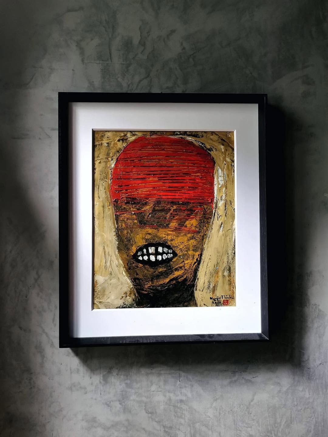 A framed expressionist painting on a concrete wall