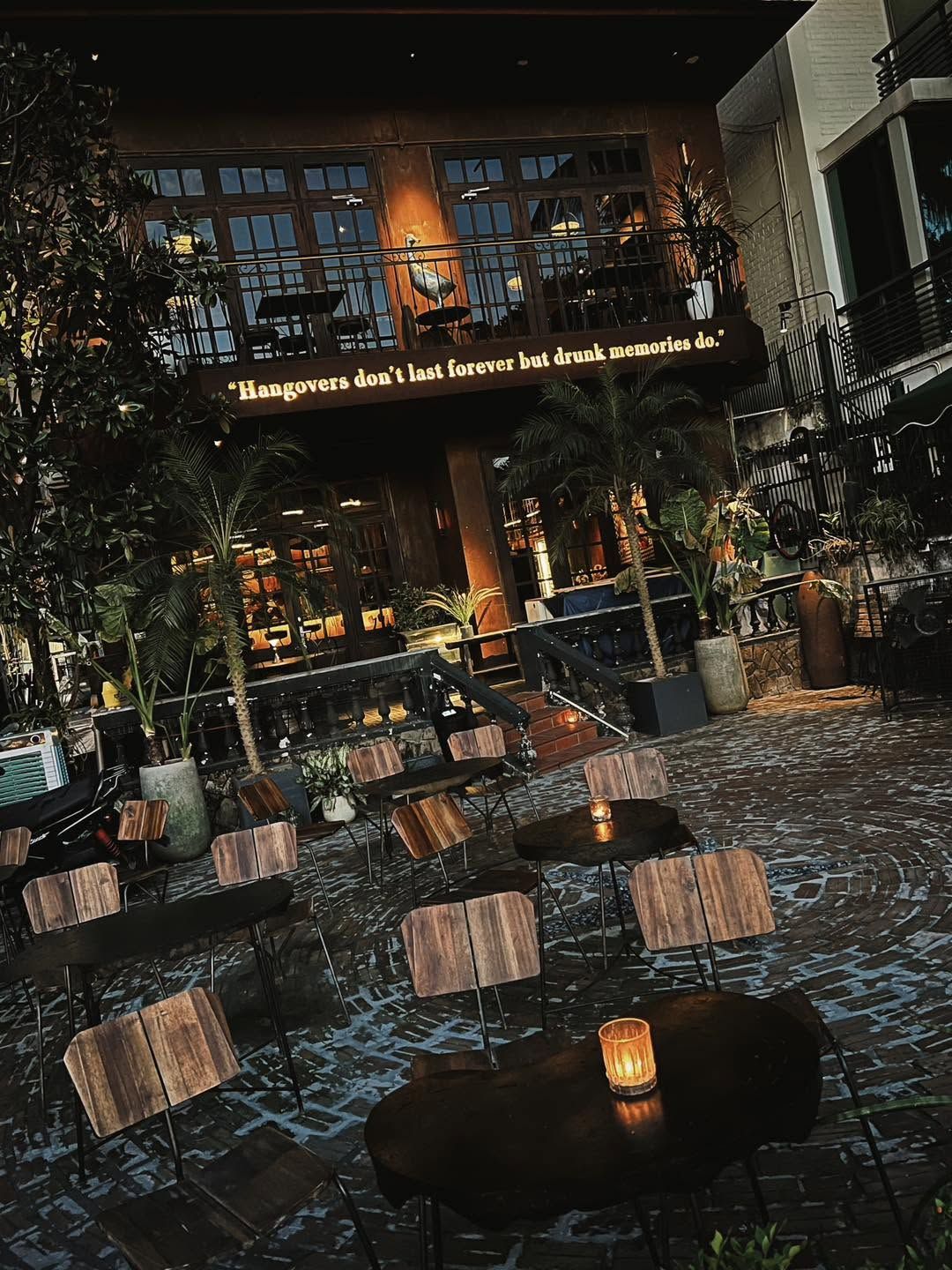 The candlelit garden in front of The Drunken Duck at dusk