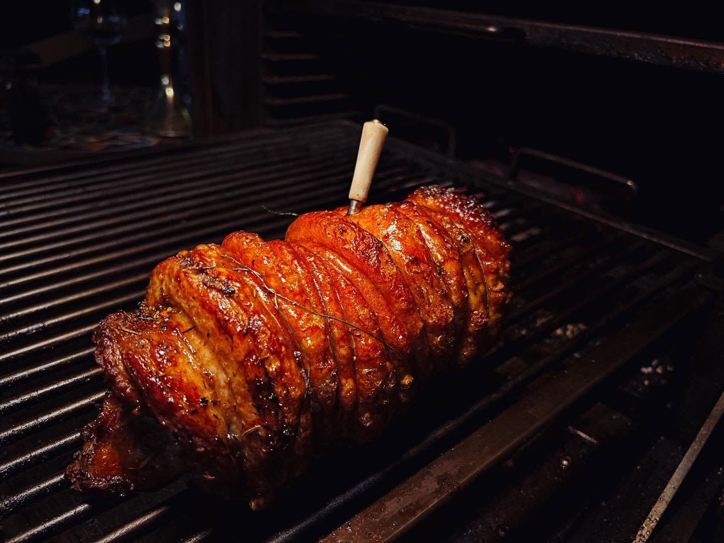 Porchetta roasting on the grill