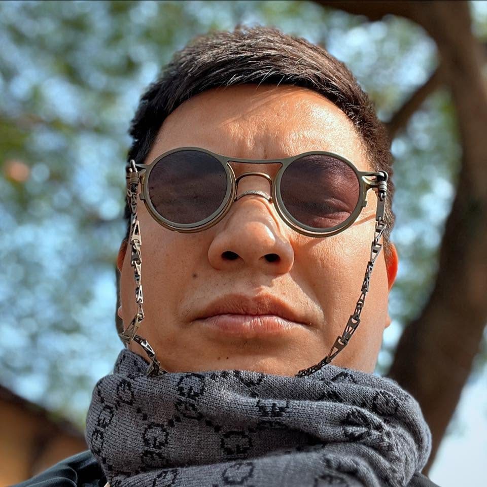 Loija, owner of The Drunken Duck, in round sunglasses and a scarf